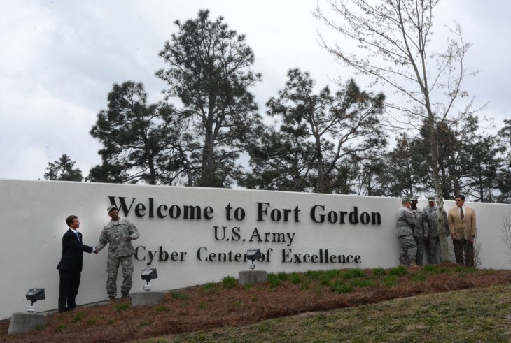 Celebrating an updated landmark at Gate 1 March 28, 2014, are Augusta Mayor Deke Copenhaver; Maj. Gen. LaWarren V. Patterson, U.S. Army Cyber Center of Excellence and Fort Gordon commanding general; Command Sgt. Maj. Ronald S. Pflieger, Cyber Center of Excellence command sergeant major; Command Sgt. Maj. Kenneth Stockton, Fort Gordon garrison command sergeant major; Col. Samuel Anderson, Fort Gordon garrison commander; and Nelson Keeler, U.S. Army Cyber Center of Excellence and Fort Gordon deputy to the commanding general. Photo by Bill Bengtson/Fort Gordon Public Affairs Office